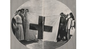 Survivors from Musa Dagh with one of the flags noticed by the French navy, The Graphic, November 13, 1915